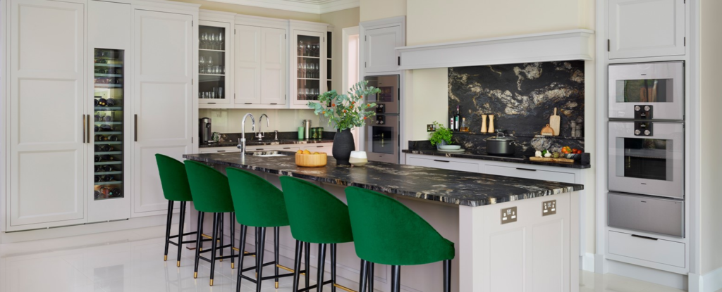 Cosmic black granite countertops and backsplash modern white kitchen design green chairs
