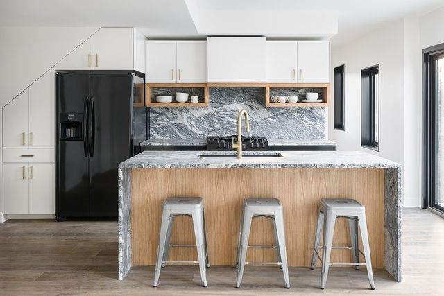 Silver Cloud Granite backsplash and countertops in modern kitchen design. 